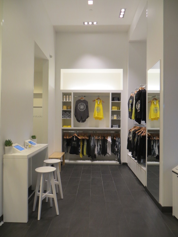 custom retail display unit and solid surface listening bar with integrated iPad holders