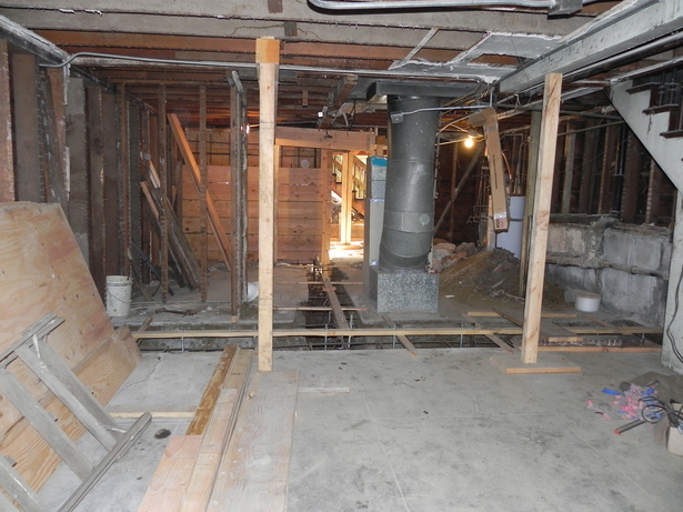 Looking toward the rear of the garage with the new Line D footings in the foreground and the new Line A concrete wall vivible at the rear. 