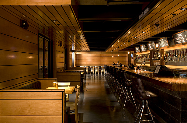 Mirrored glass inserts set within the wood birch wall panels then fill the room with a random pattern to help create a sparkle, and to showcase the interactions of people throughout the room.