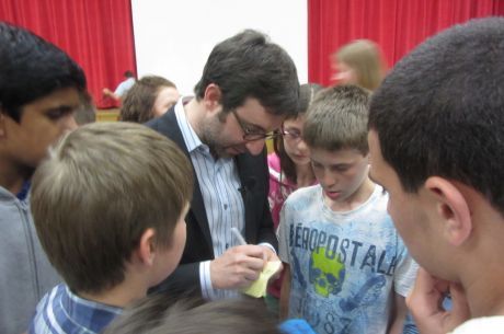 Danny Forster, who hosts Build It Bigger on the SCIENCE channel, signs autographs inside the gymnasium at Chippewa Middle School after his presentation. (Jennifer Delgado/Tribune)