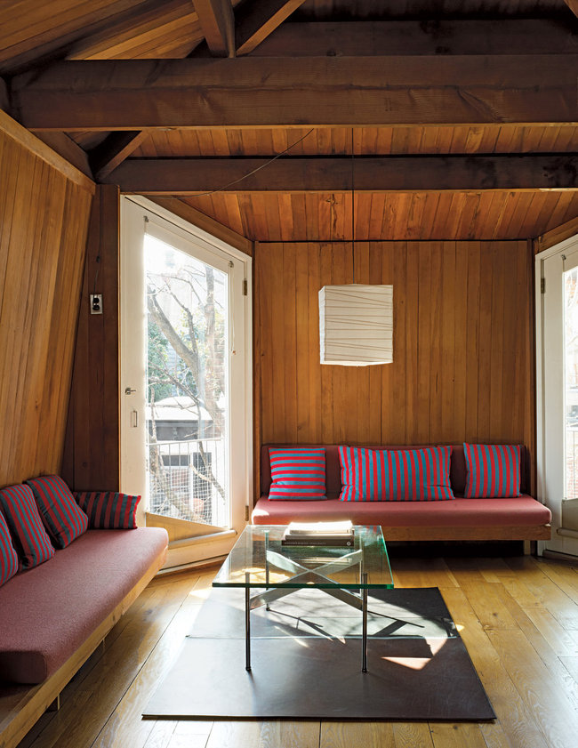 The third floor contains a sitting room with built-in sofas. Annie Schlechter