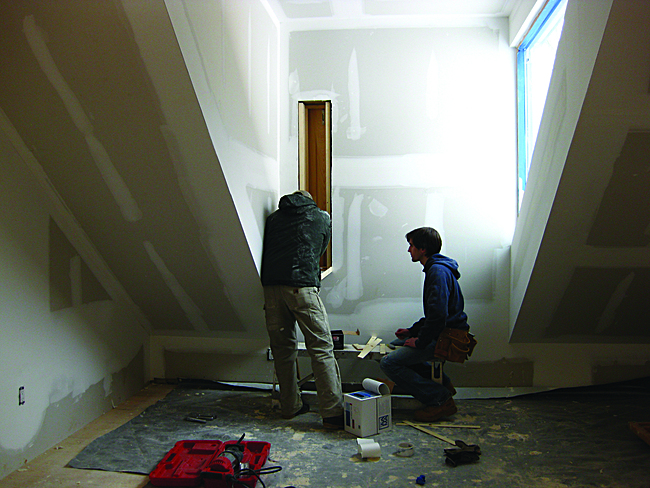 Students installing ventilation window