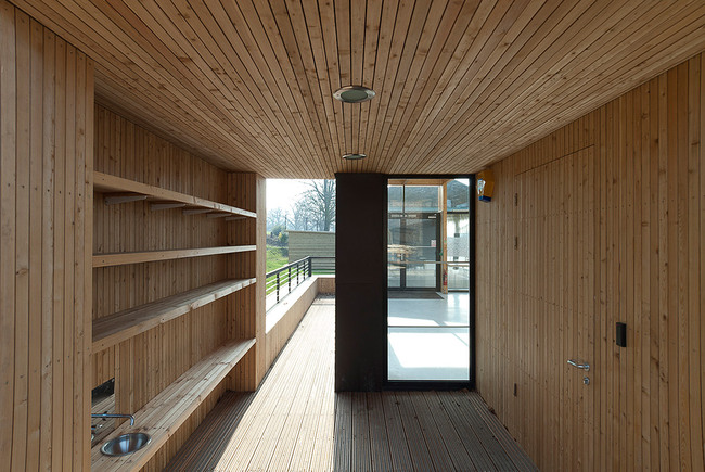 Timber-lined children's boot store leading to the animal enclosure (Photo: Michael Harding)