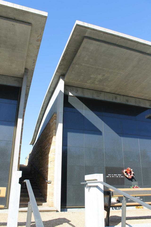A staircase leading up from the main plaza to the grassy hill above