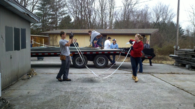 Anna and Ryan help unload the leftover Alpolic