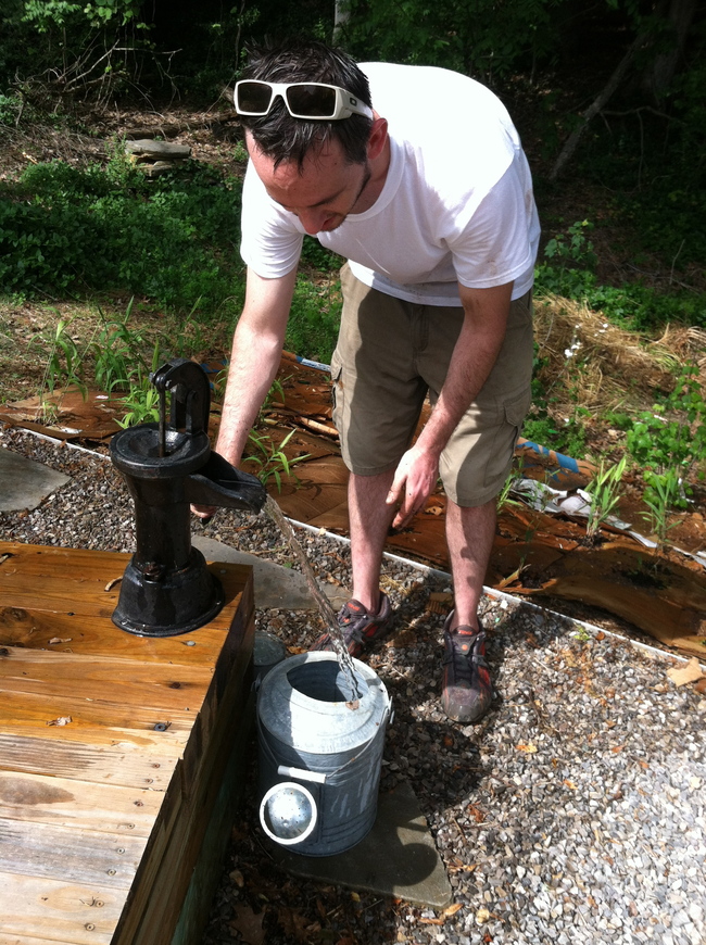 Before leaving for the day we made sure to water everything, including the vegetable garden we planted a few weeks ago. Phil is using harvested rainwater to fill up the watering can. 