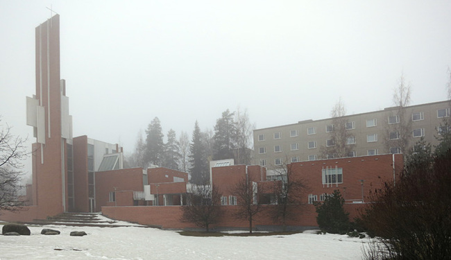 A haze shrouded Männistö Church by Juha Leiviskä in Kupio, Finland.