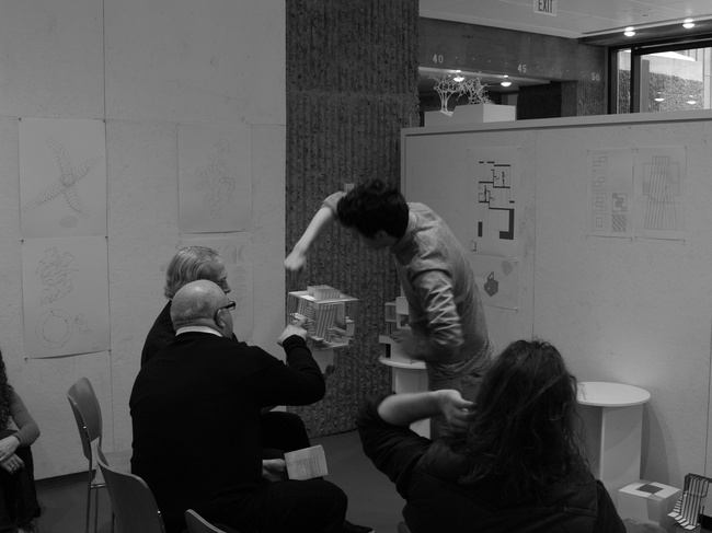 Russell presenting his model to critics Peter and Joeb