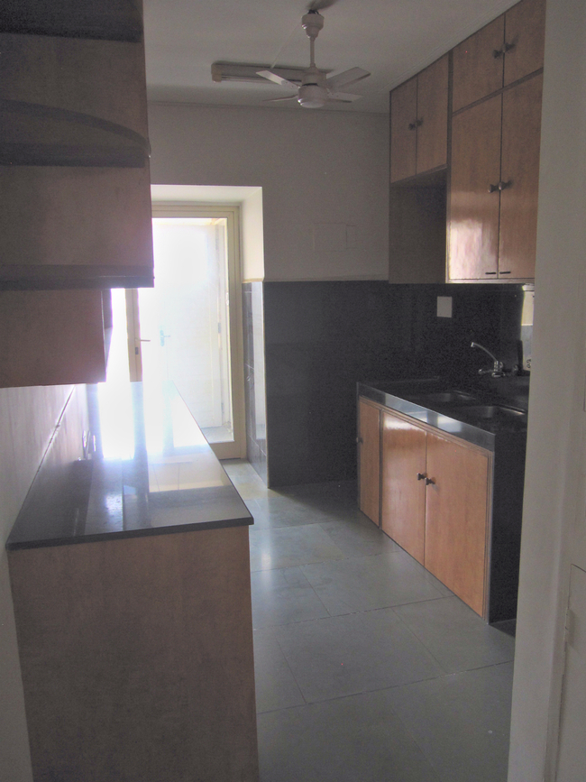 In relation to the scale of the remainder, the kitchen appears meek in scale