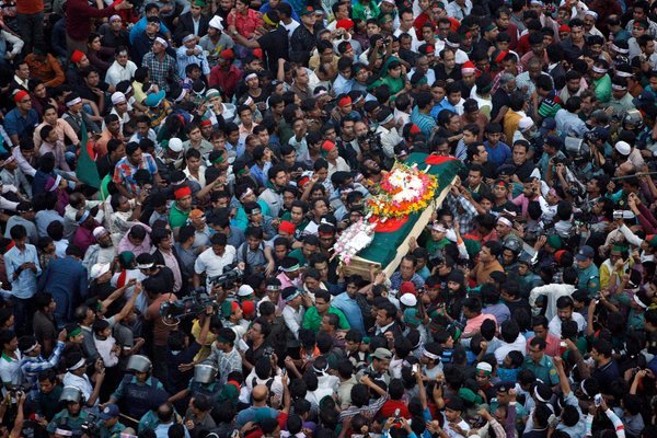 Mourners in Bangladesh on Saturday carried the coffin containing the body of Rajib Haider, an organizer who was killed.