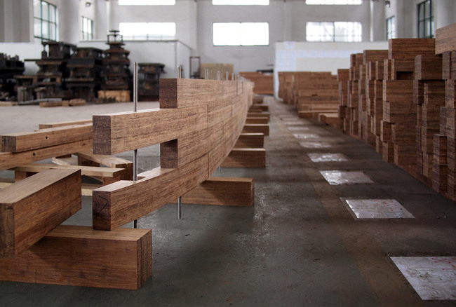 The image is showing an assembly test in the CNC cutting facilities for the bamboo block walls of the main auditorium. (Photo: Martin Lukasczyk)