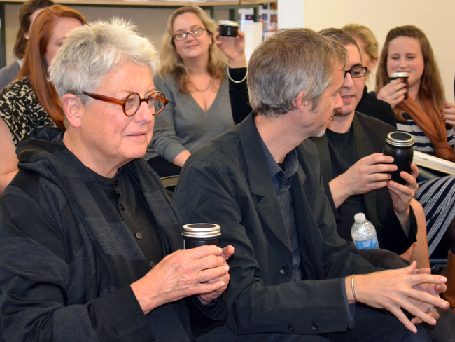 Merril Elam (left) takes a sniff of the sweet, BBQ infused aroma from 