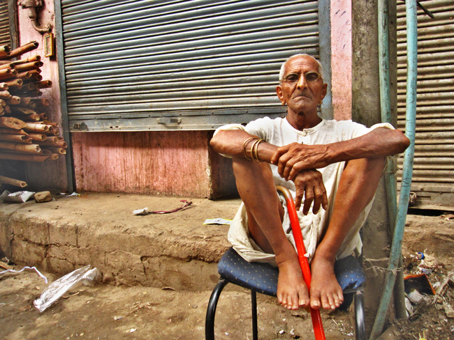 A regal old man waits