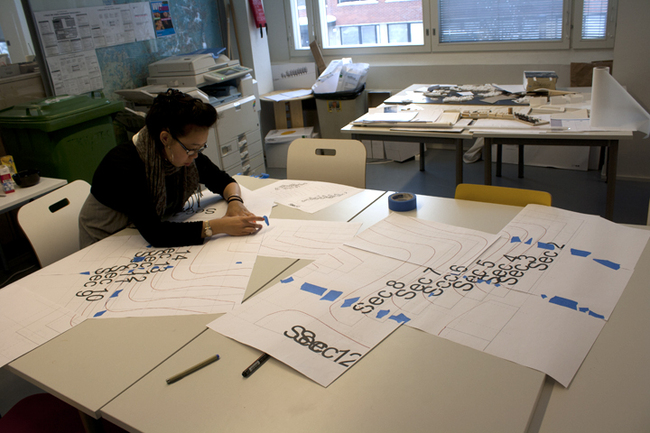 3. Jennifer Wong taping sheets of 25mm contour section cuts of the Kari 3 chair