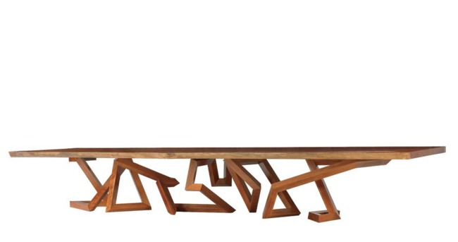 A 17-foot-long dining table (shown in redwood) is supported by a complex base formed from a twisting single line—a common theme in Pitt’s designs Photo- Ellen McDermott 