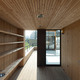 Timber-lined children's boot store leading to the animal enclosure (Photo: Michael Harding)
