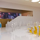 The Man in the Blue Coat walks through the gallery displaying a Gelatin special exhibit.