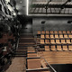 The side balcony of the small auditorium. The material for the wall is black GRG, and the balconies are made of solid bamboo. (Photo: Jussi Tiainen)