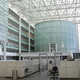 Visitors to the Sandra Day O'Connor Federal Courthouse pass through a very uncourtlike glass enclosed atrium which could aptly be described as a hothouse. The cylindrical glass center point houses a ceremonial courtroom. (Image via http://www.doney.net/aroundaz/phoenix-oconnor.htm)