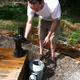 Before leaving for the day we made sure to water everything, including the vegetable garden we planted a few weeks ago. Phil is using harvested rainwater to fill up the watering can. 