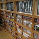 Bookcase and sunlight through the combination of glass and raw material