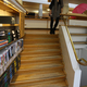 The Regional Library of Lapland. Jennifer Wong on sunken reading room stairs.