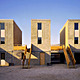 Incremental Housing: BEFORE: Architects: Alejandro Aravena, Tomás Cortese, Emilio de la Cerda, Andrés Iacobelli, and Alfonso Montero, Elemental (Chile); engineers: José Gajardo, Juan Carlos de la Llera; urbanization specialist: Proingel and Abraham Guerra. Construction: Loga S.A. Client: Chile Barrio. Iquique, Chile, 2003-4. Concrete, brick concrete, wood panels. Photo: © Elemental 