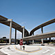 A present day image and future collage of the 105_100 Freeway Interchange. The collage titled ‘Back to the Future 2’ is by Shift A+U based in Rotterdam. Photograph by Jaime Vazquez, collage by Shift Architecture.