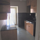 In relation to the scale of the remainder, the kitchen appears meek in scale