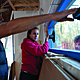 Students installing custom-made windows
