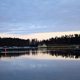 Logging boat gliding quietly through the lakes in Savonlinna, Finland.