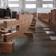 The image is showing an assembly test in the CNC cutting facilities for the bamboo block walls of the main auditorium. (Photo: Martin Lukasczyk)