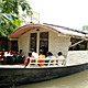Floating Community Lifeboats: Architect: Mohammed Rezwan (Bangladesh). Implemented by Shidhulai Swanirvar Sangstha on the Atrai, Barnoi, Gurnoi, Nandhakuja, Gumani, and Boral Rivers in Natore, Pabna, and Sirajganj districts, Bangladesh, 2002-present. Sal wood and other woods, plywood, bamboo, angle iron, iron sheet, flat bar. Photo: © Abir Abdullah/Shidhulai Swanirvar Sangstha 