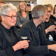 Merril Elam (left) takes a sniff of the sweet, BBQ infused aroma from 