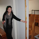 Jennifer Wong displaying the scale of the door detail at the Vuoksenniska Church (Church of 3 Crosses), Vuoksenniska, Finland 1958
