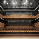 The small auditorium as seen from stage. The 700 seats are partly retractable to enable a multifunctional usage of the space. (Photo: Jussi Tiainen)