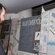 Attendee looks at project display boards during Infill Philadelphia: Soak It Up Design Awards event held March 7, 2013 at the Academy of Natural Sciences of Drexel University © CG Lawrence Photography (Gregory Clarke)